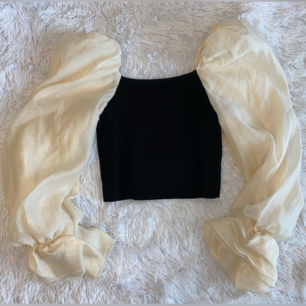 Stretchy black cropped top w/ Fluffy cream fleece long sleeves.